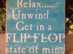 a sign that says relax unwind get in a flip flop state of mind