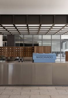 a metal counter with a sign that says mascavado in front of it