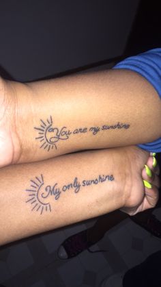 two people with tattoos on their arms saying, my only sunshine and my only sunshine