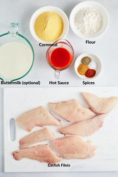 the ingredients to make fish fillets are shown on a cutting board