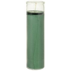 a tall glass filled with green liquid