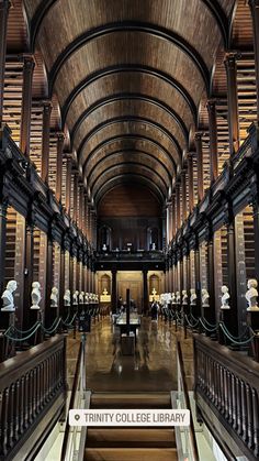 the inside of a large library with many bookshelves