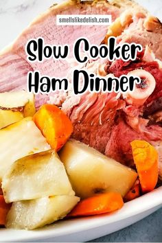 slow cooker ham dinner on a plate with carrots, potatoes and other vegetables