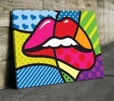 a colorful painting of a woman's lips on a wooden wall with polka dots