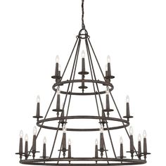 an iron chandelier with candles hanging from the bottom and one light on top