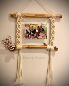 a wooden frame with rope hanging from it