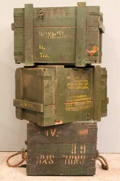 three wooden boxes stacked on top of each other