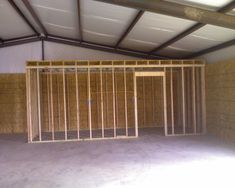 the inside of a building that is being built with wood framing and insulations on the walls