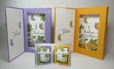 three different colored cards with flowers and butterflies