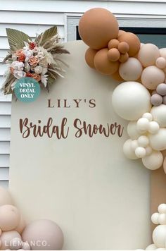 a sign that says lily's bridal shower with balloons and flowers on it