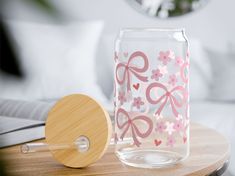 a glass vase sitting on top of a wooden table