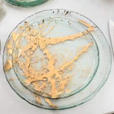 a dirty glass plate sitting on top of a white table