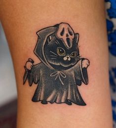 a black cat with a wizard costume on it's leg