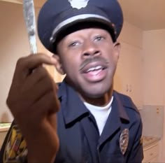 a police officer holding a knife in his hand