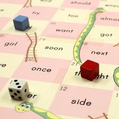 a board game with dices and snakes on it