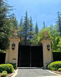 an entrance to a home with two gates