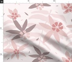 a pink and brown flower pattern on a white background with a ruler in the foreground