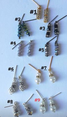 several different types of earrings are shown on the table with numbers in front of them