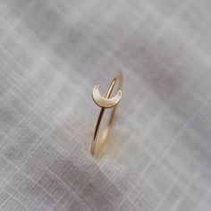 For the minimalist moon lovers out there. Our Luna Ring is perfect on its own or in any ring stack. - Made with 14k gold filled or sterling silver material - 1mm thick band - 6x5mm crescent moon shaped accent Please note: You may experience a slight color difference in places where the metal has been soldered making every piece truly unique. If you do not see your size, please reach out to us by email at info@hellorising.com. We believe that everyone deserves to wear beautiful jewelry. Purchase Moon Ring Gold, Modern Gold Rings Unique, Silver Rings For Women Unique, Modern Gold Ring, Moon Rings, Sun And Moon Rings, Ring Moon, Unique Silver Jewelry, Modern Gold Jewelry