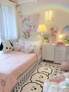 a child's bedroom decorated in pink and white