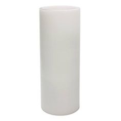 a tall white vase sitting on top of a table