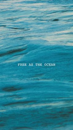 there is a blue ocean with the words free as the ocean