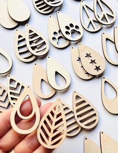 "18 Pairs of Unfinished Wood Earring Jewelry Blanks Unfinished Wood Cutouts 2\" Length If you need a different size or quantity please let us know and we will be glad to work with you. MADE RIGHT HERE IN TEXAS Each is made to order They are laser cut and lightly sanded  These items are not Toys. These items may contain small parts that can become dislodged if the items are played with. Please do not allow a small child to play with these items." Wood Earring, Laser Cutout, Wood Cutouts, Earring Jewelry, Wood Earrings, Unfinished Wood, Laser Engraved, Wood Crafts, Laser Engraving