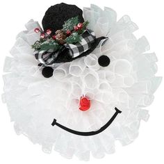 a black and white snowman with a hat on it's head, wearing a tulle