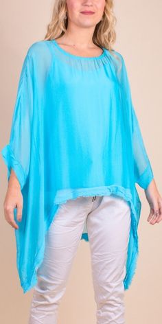 2 Piece High-Low Silk Kaftan Featuring a Raw Edge Bottom Hemline. Exterior 100% Silk Interior 95% Viscose, 5% Elastic One Sizes Fits Most Made in Italy Model 5'7 Spring Layering Tunic Top, Stretch Solid Color Blouse For The Beach, Summer Tunic Blouse For Layering, Airy Summer Top For Layering, Airy Top For Summer Layering, Airy Summer Tops For Layering, Summer Layering Top, Solid Color Summer Tunic Top, Solid Color Flowy Rayon Tops