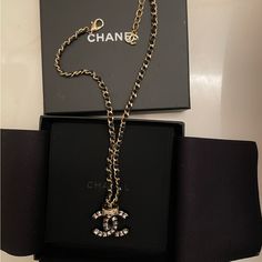 Black And Gold Chain Chanel Necklace With Crystal Cc Logo. You Can Also Flip It For A Black Cc Logo. This Item Has Only Been Worn Once And Comes With The Original Tag And Box With The Interior Cloth That Holds The Necklace. Jewelry Chanel, Chanel Necklace, Chanel Jewelry, Crystal Chain, Cc Logo, Black And Gold, Gold Chain, Gold Chains, Womens Jewelry Necklace