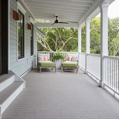 the porch has two chairs on it