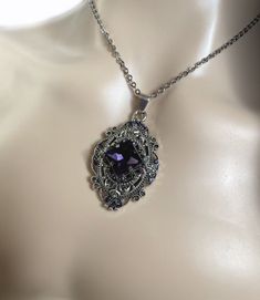 This richly detailed antiqued silver plated filigree pendant, is adorned with dazzling VIOLET PURPLE glass rhinestones that perfectly accentuate a larger jewel in the center. Pendant measures 2 1/4" tall (including the bail) and 1 1/4" wide. It is worn on a cable chain in your choice of length and fastens with a lobster clasp.Listing is for necklace ONLY. Matching earrings are listed in our store.This is available in a variety of stone colors in our store, along with matching earrings. If you do Deep Purple Wedding, Violet Jewelry, Purple Goth, Goth Victorian, Dope Jewelry Accessories, 1920's Style, Dark Amethyst, Victorian Necklace, Jewelry Lockets