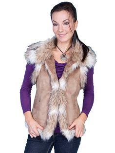 Introducing our Yellowstone Fashion Faux Fur Vest – a must-have statement piece for the style-savvy adventurer. Embrace the rugged elegance of the wild west with this fashionable vest that seamlessly blends comfort and trendsetting style. Bold and luxurious, this vest boasts generous faux fur on the shoulders, cascading down the front, and enveloping the entire bottom. The result? A stunning look that captures the essence of Yellowstone fashion – where nature meets chic sophistication. Designed American West Handbags, Flannel Vest, Western Vest, Western Outfit, Leather Company, Cowgirl Outfits, Faux Fur Vest, Layering Outfits, Faux Fur Vests