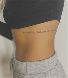 a woman's stomach with the words everything happens for a reason written on it