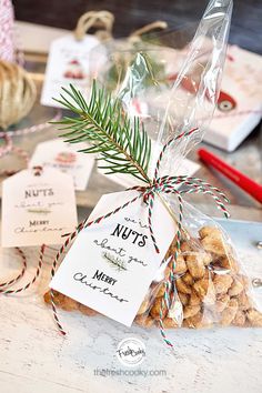 a bag filled with nuts sitting on top of a table next to other christmas decorations