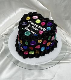 a heart shaped birthday cake on a plate