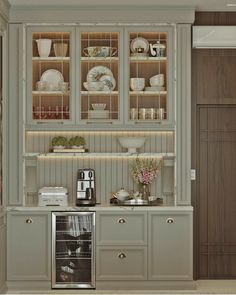 an image of a kitchen setting with dishes on the shelves