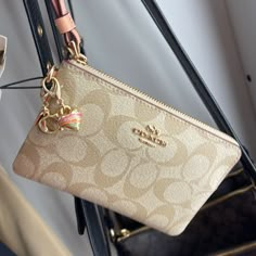 Coach Boxed Corner Zip Wristlet In Signature Canvas Gold/Light Khaki/Faded Blush Product Details Signature Coated Canvas And Smooth Leather Two Credit Card Slots Zip-Top Closure, Fabric Lining Wrist Strap Attached 6 1/4" (L) X 4" (H) X 1/2" (W) Includes Removable Charms Packaged In A Coach Gift Box Style No. C8726 Cute Coach Wallets, Gold Coach Wristlet For Everyday, Coach Gold Rectangular Wristlet, Beige Coach Pouch Wristlet, Coach Wristlet Wallet, Denim Wristlet, Pretty Tote Bags, Coach Wallet With Zipper Closure For On-the-go, My Style Bags