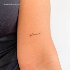 a woman's arm with a tattoo that reads, beloved on it and the word