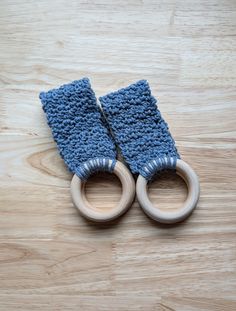 two wooden rings with blue yarn on them