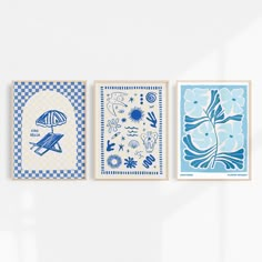 three blue and white prints hanging on the wall next to each other in different designs