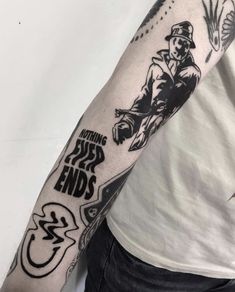 a man with a tattoo on his arm