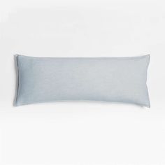 a blue pillow on a white background