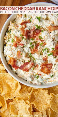 bacon cheddar ranch dip in a bowl surrounded by chips