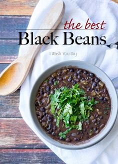 the best black beans i wash you dry is in a white bowl with spoons