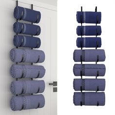 there are several rolls of blue towels hanging on the wall