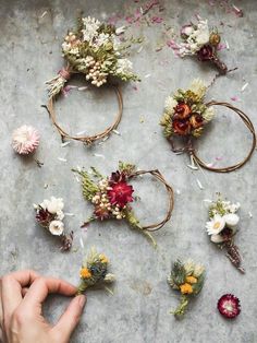 someone is arranging flowers on the table to make their own bouquets for an event