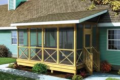 a small blue house with a porch on the front