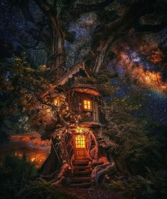 a tree house in the woods with stairs leading up to it's door and windows