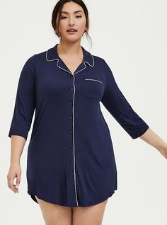 Cozy up in an undeniably soft sleep shirt that comes in a tunic length with contrast white piping that pops. Notch collar. V-neck. Chest pocket. 3/4 sleeves. Button front. Contrast white piping. CONTENT + CARERayon/spandex. Wash cold; dry flat. Imported plus size sleepwear. SIZE + FITModel is 5’11”, size 1. Size 2 measures 38” from shoulder. The best plus size women's super soft button through sleep gown tops & dresses in navy. These comfy pajamas will be your favorite PJs to sleep in or lounge Sleep Gown, Chemise Dress, Plus Size Sleepwear, Pajamas Comfy, Button Up Dress, Notch Collar, Lace Inset, Sleep Shirt, Tunic Shirt